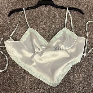 Light blue silky tank top. Cropped. V neck. Comfortable. Size: small